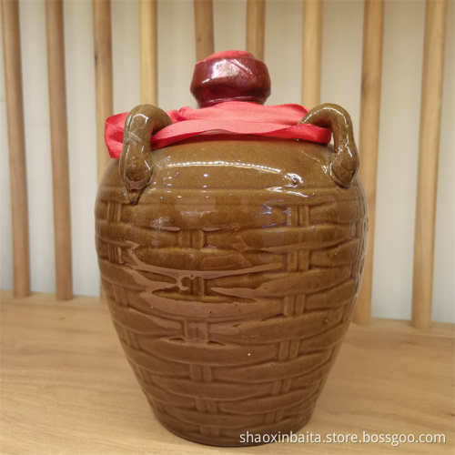 Yellow porcelain jar filled with yellow wine
